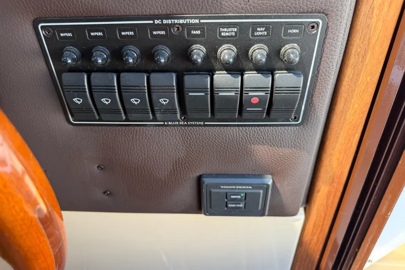Slide: The Image of Control panel of a 2017 Ranger Tugs R-31 S boat with labeled switches. - 34