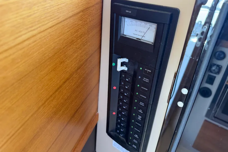 Slide: The Image of Electrical panel on 2017 Ranger Tugs R-31 S boat, featuring AC voltage meter. - 56