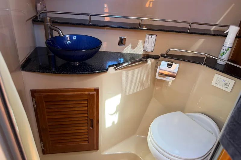 Slide: The Image of 2017 Ranger Tugs R-31 S bathroom with blue vessel sink and modern fixtures. - 46