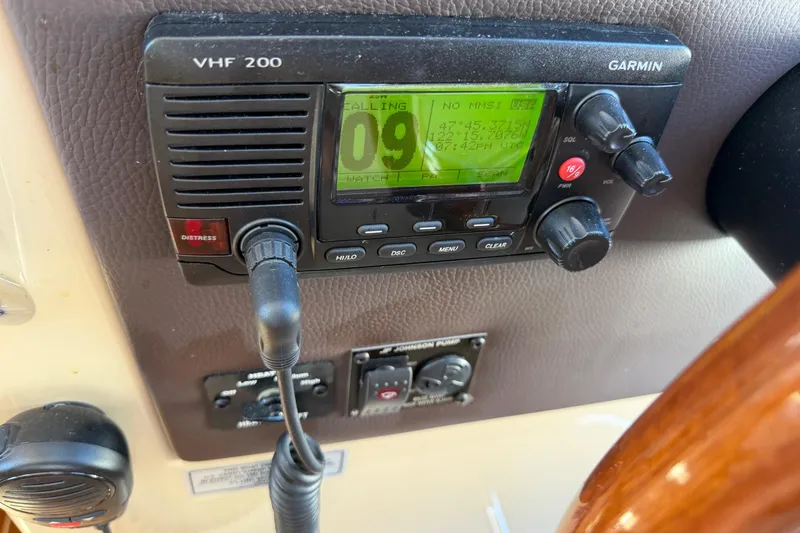 Slide: The Image of Garmin VHF 200 radio on 2017 Ranger Tugs R-31 S boat dashboard. - 33