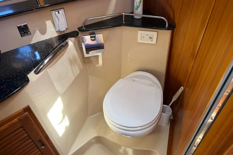 Slide: The Image of 2017 Ranger Tugs R-31 S bathroom with modern fixtures and wooden accents. - 47
