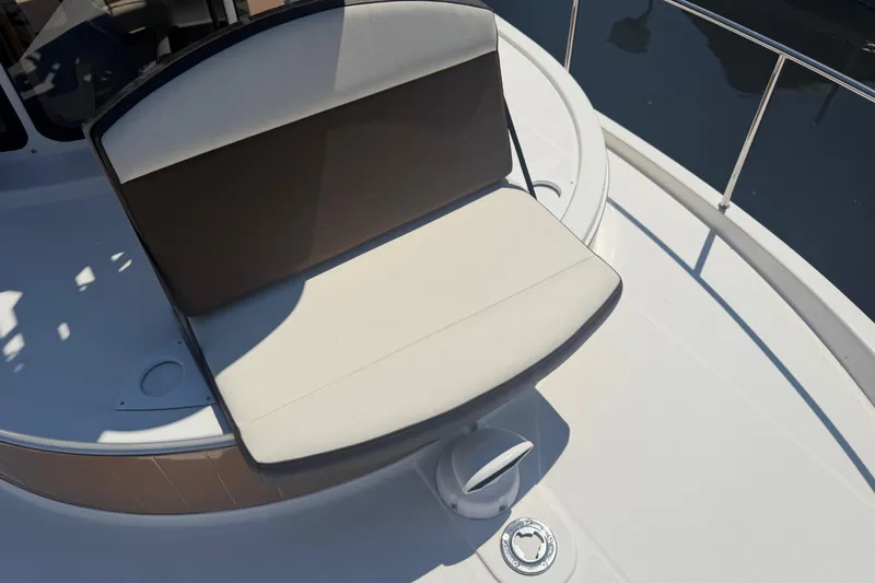 Slide: The Image of 2017 Ranger Tugs R-31 S boat seating area with cushioned bench on deck. - 69