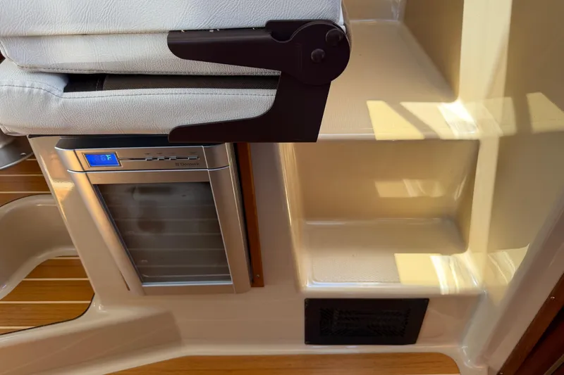 Slide: The Image of Interior of 2017 Ranger Tugs R-31 S with compact fridge and seating. - 36