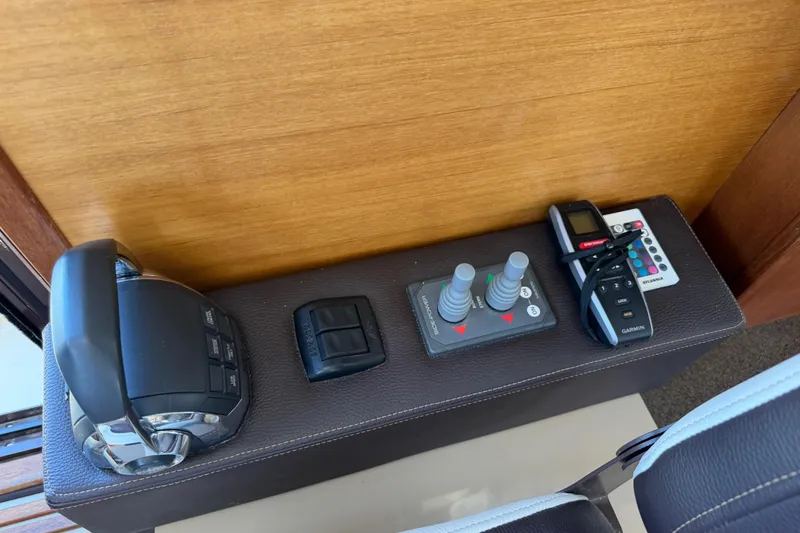 Slide: The Image of Control panel of 2017 Ranger Tugs R-31 S with joystick and throttle controls. - 35