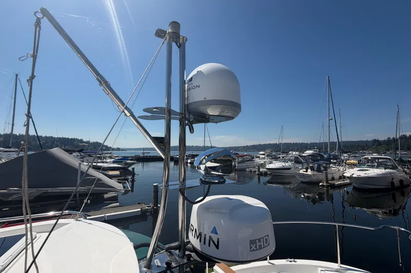 Slide: The Image of 2017 Ranger Tugs R-31 S docked at a marina under clear blue skies. - 75