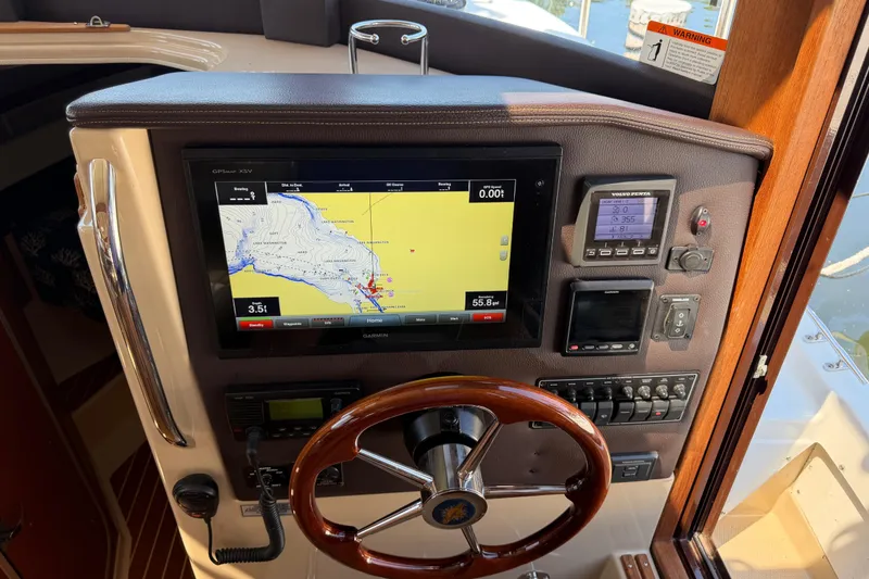 Slide: The Image of 2017 Ranger Tugs R-31 S helm with GPS navigation and control panel. - 28