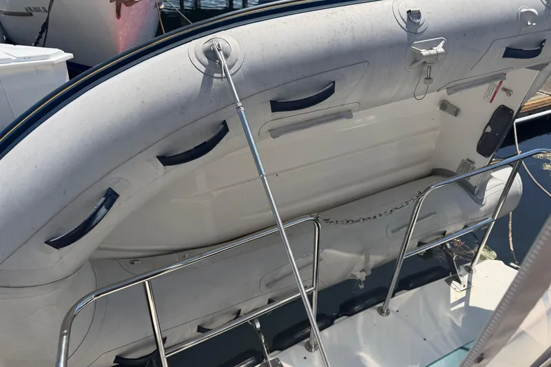 Slide: The Image of Inflatable boat on 2017 Ranger Tugs R-31 S yacht, secured with metal railing. - 72