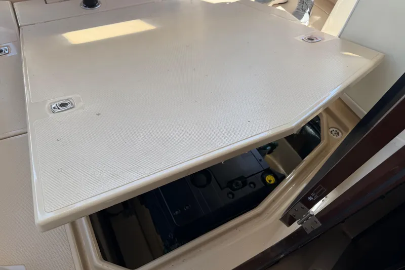Slide: The Image of 2017 Ranger Tugs R-31 S engine compartment with open hatch, showcasing interior details. - 58