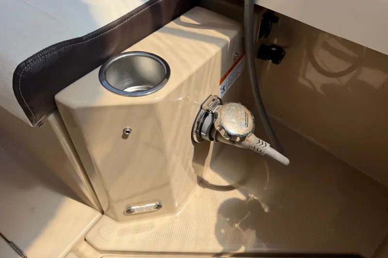 Slide: The Image of 2017 Ranger Tugs R-31 S boat interior with cup holder and control lever. - 74