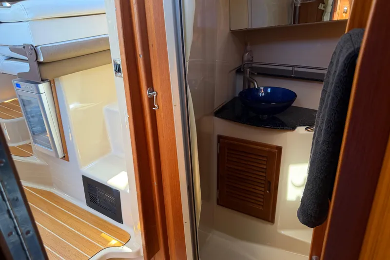 Slide: The Image of 2017 Ranger Tugs R-31 S interior with compact bathroom and modern sink design. - 45