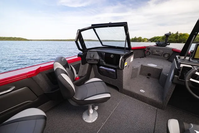 Slide: The Image of The image shows the cockpit of a 2027 Lund 2275 Tyee Sport boat with two seats and a helm. - 9