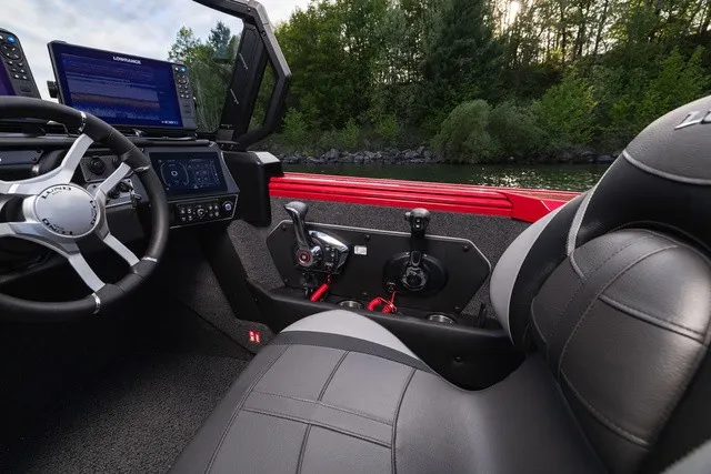 Slide: The Image of The image shows the cockpit of a 2027 Lund 2275 Tyee Sport boat with modern controls. - 11