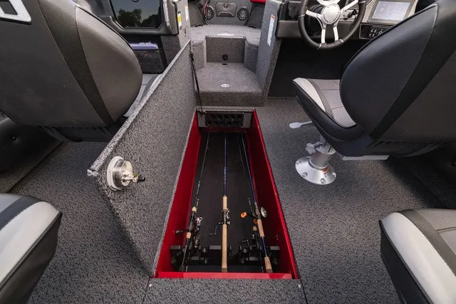 Slide: The Image of Interior of the Lund 2275 Tyee Sport featuring storage for fishing rods. - 7