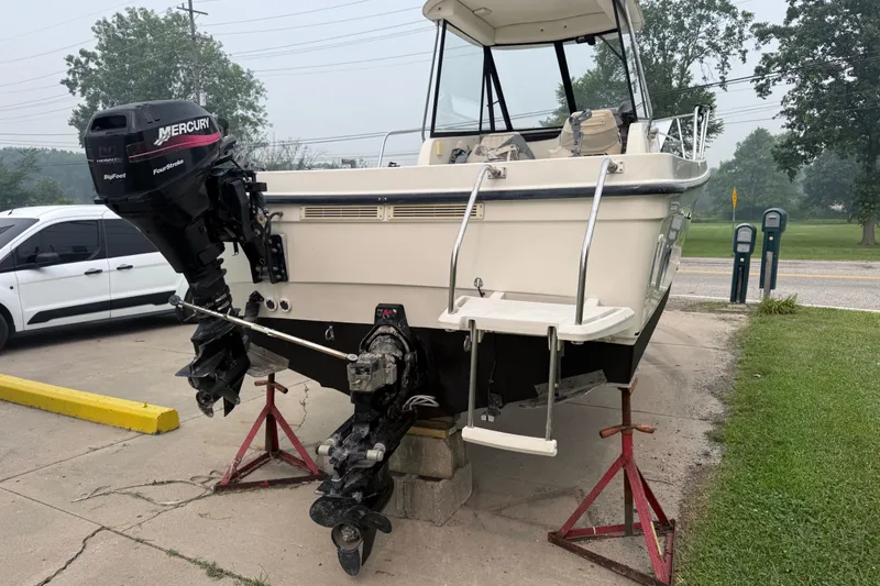 Slide: The Image of 2002 Bayliner 2052 Trophy Walkaround DX/LX on stands, featuring Mercury outboard motor. - 3