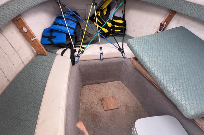 Slide: The Image of Interior cabin of 2002 Bayliner 2052 Trophy Walkaround DX/LX with life jackets and seating. - 7
