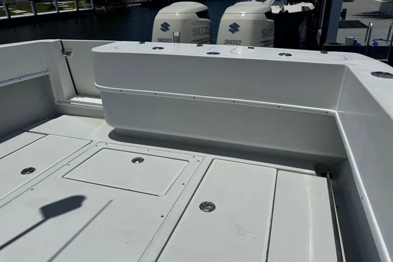 Slide: The Image of 2006 Contender 31 Open boat deck with Suzuki 300 engines in marina. - 26