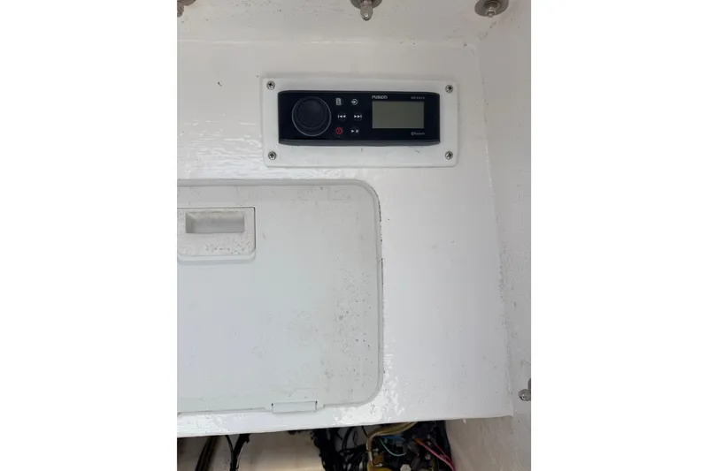 Slide: The Image of Control panel inside a 2006 Contender 31 Open boat. - 32