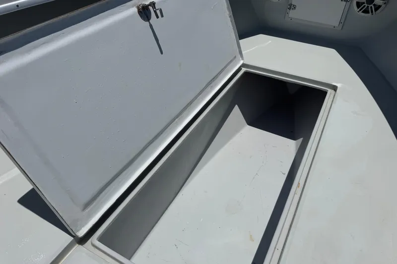 Slide: The Image of Open storage compartment on a 2006 Contender 31 Open boat deck. - 21