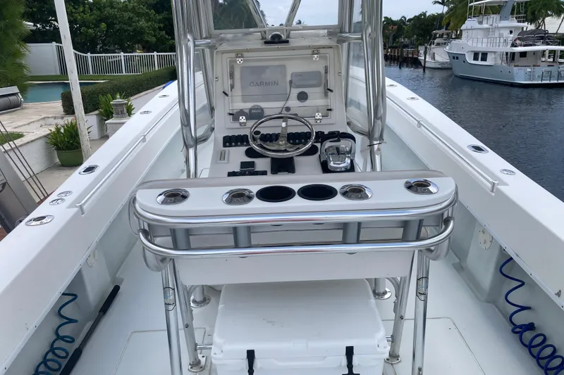 Slide: The Image of 2006 Contender 31 Open boat cockpit with Garmin navigation system and rod holders. - 22