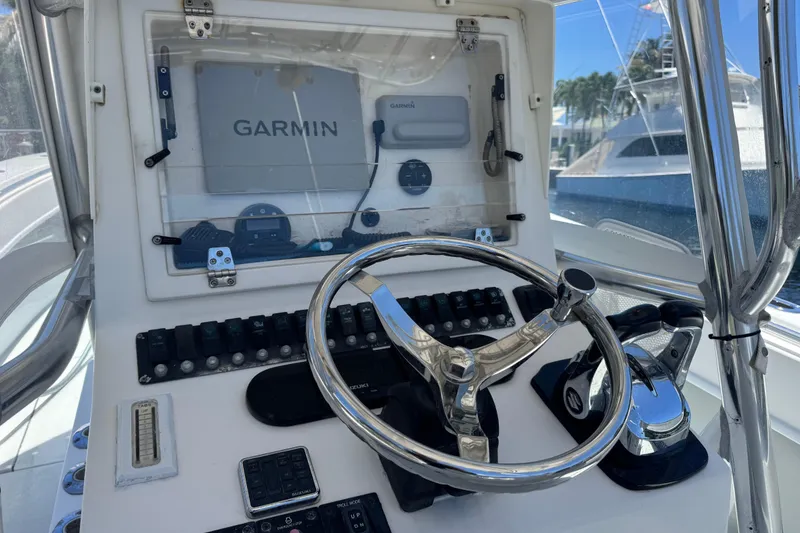 Slide: The Image of Helm of 2006 Contender 31 Open boat with Garmin navigation system. - 16