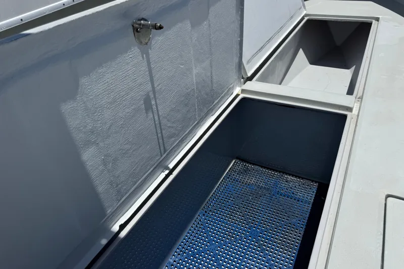 Slide: The Image of Open storage compartment on a 2006 Contender 31 Open boat. - 22