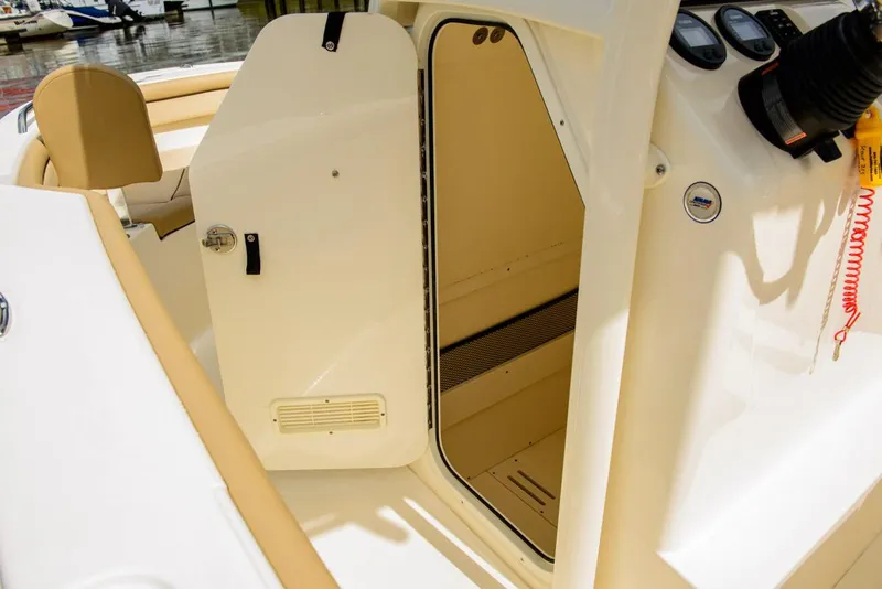 Slide: The Image of Manufacturer Provided Image: 2019 Scout 215 XSF boat interior with open cabin door. - 15