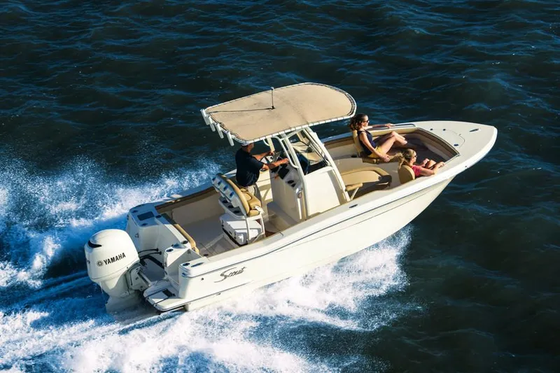 Slide: The Image of Manufacturer Provided Image: 2019 Scout 215 XSF boat cruising on water with passengers. - 10