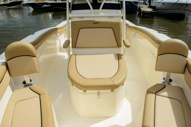 Slide: The Image of Manufacturer Provided Image: 2019 Scout 215 XSF boat interior with tan seating and storage compartments. - 12