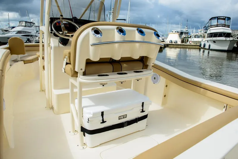 Slide: The Image of Manufacturer Provided Image: 2019 Scout 215 XSF boat interior with Yeti cooler at marina. - 14