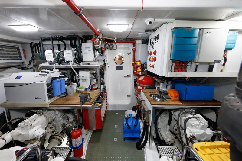 Slide: The Image of Engine room of 2016 Hunt Yachts 72 FB, featuring advanced equipment and organized layout. - 74