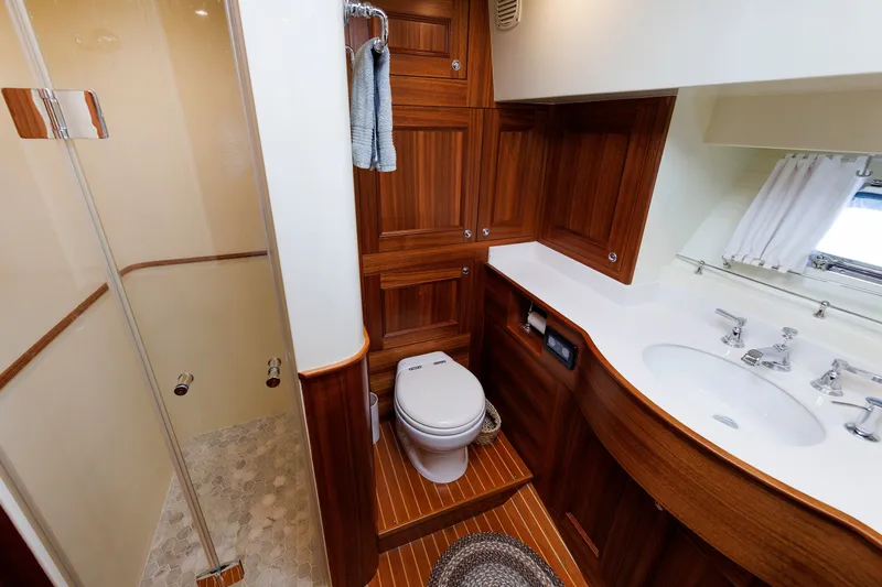 Slide: The Image of Luxurious 2016 Hunt Yachts 72 FB bathroom with wood accents and modern fixtures. - 44