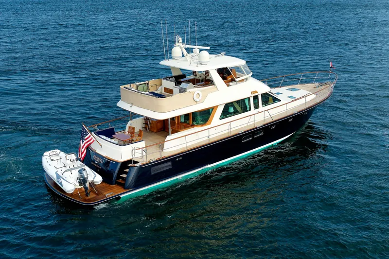 Slide: The Image of Luxurious 2016 Hunt Yachts 72 FB cruising on open water, showcasing elegant design and spacious decks. - 80