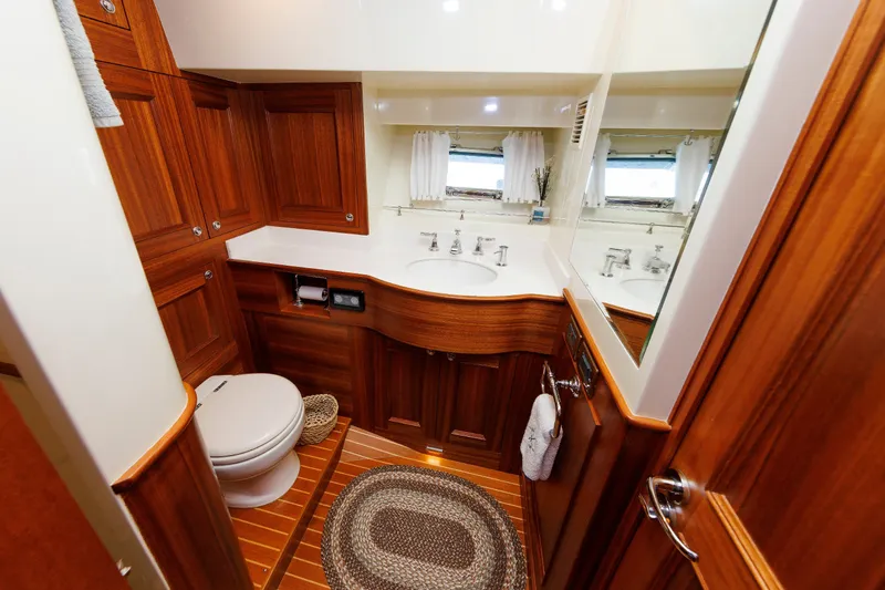Slide: The Image of Luxurious wooden bathroom interior on 2016 Hunt Yachts 72 FB, featuring elegant fixtures and decor. - 45