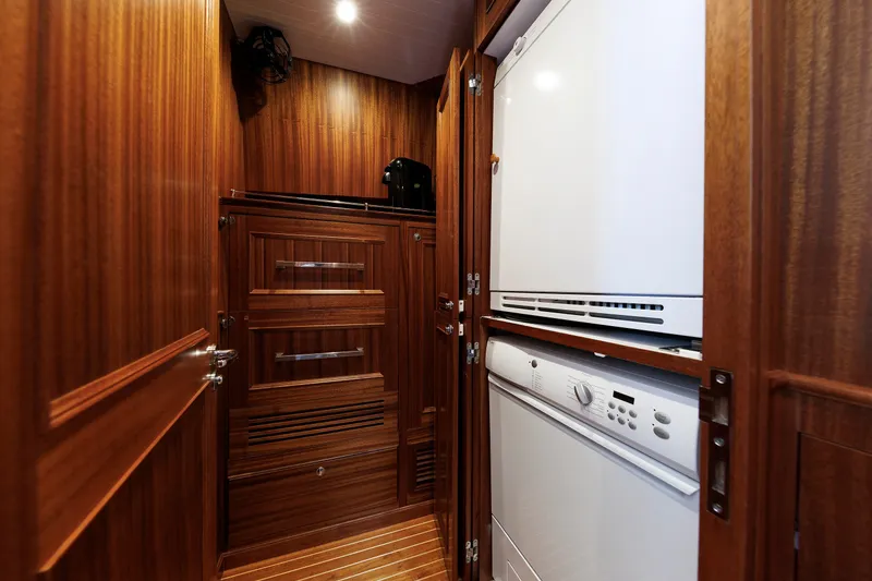 Slide: The Image of Laundry area with wood paneling on a 2016 Hunt Yachts 72 FB. - 25