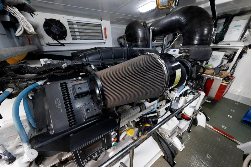 Slide: The Image of Engine room of a 2016 Hunt Yachts 72 FB, showcasing mechanical components and ventilation. - 68
