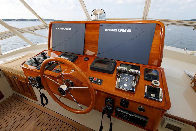 Slide: The Image of Helm of 2016 Hunt Yachts 72 FB with Furuno navigation displays and wooden steering wheel. - 53