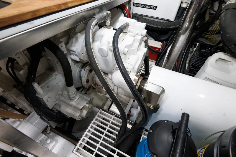 Slide: The Image of Engine room of 2016 Hunt Yachts 72 FB, showcasing mechanical components and wiring. - 71