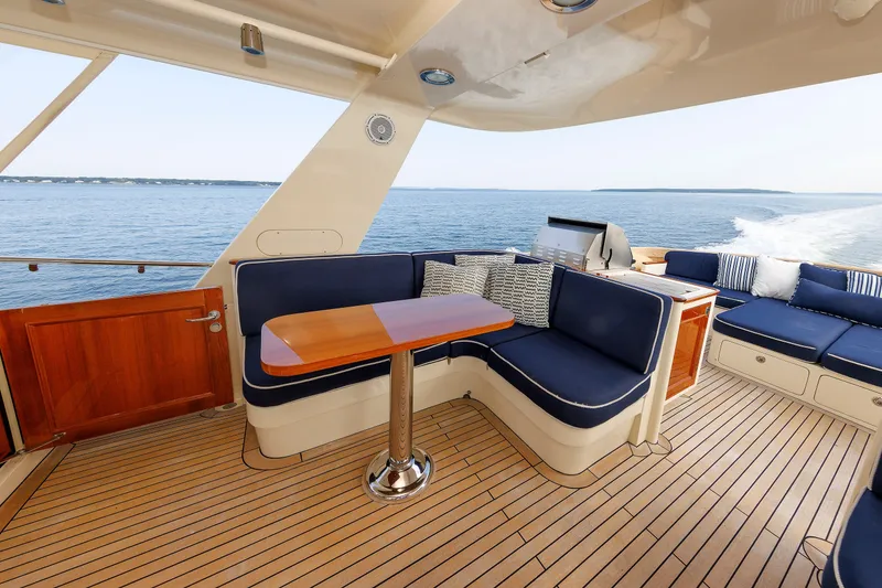Slide: The Image of Luxurious 2016 Hunt Yachts 72 FB deck with elegant seating and ocean view. - 54