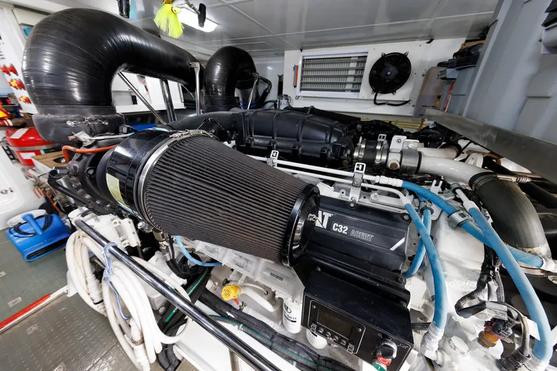 Slide: The Image of Engine room of 2016 Hunt Yachts 72 FB, featuring a powerful C32 engine. - 69