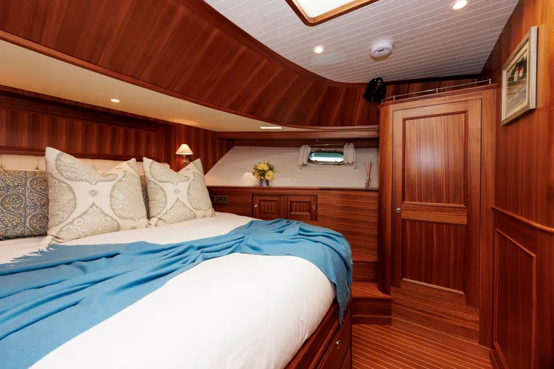 Slide: The Image of Luxurious cabin interior of 2016 Hunt Yachts 72 FB with elegant wood finish and cozy bedding. - 38