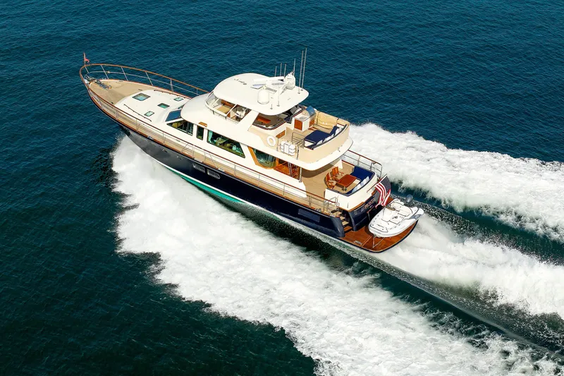 Slide: The Image of Luxury 2016 Hunt Yachts 72 FB cruising on open water, showcasing sleek design and elegance. - 85
