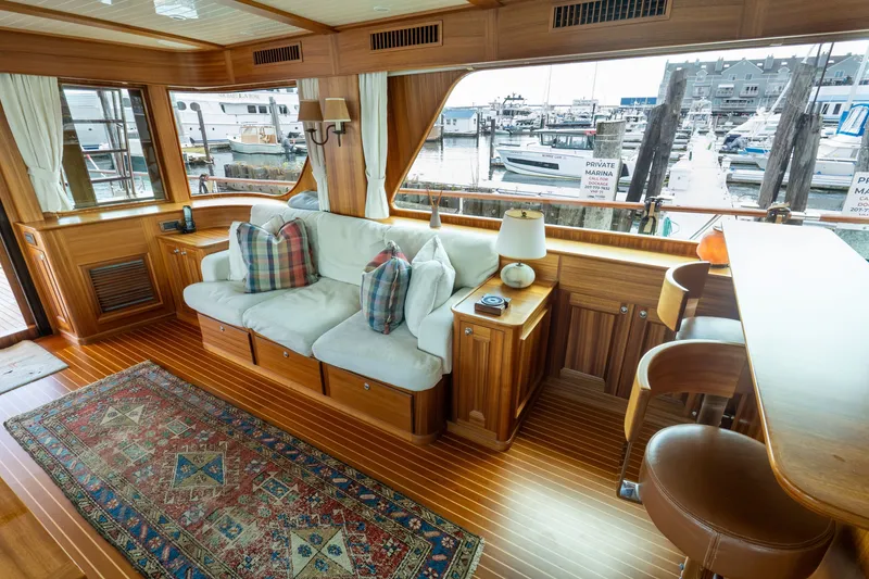 Slide: The Image of Luxurious interior of 2016 Hunt Yachts Ocean Series 72FB with elegant wood finish and marina view. - 14