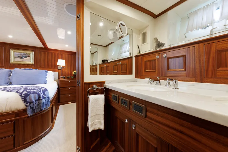 Slide: The Image of Luxurious 2016 Hunt Yachts 72 FB interior with elegant wood finishes and plush bedding. - 32