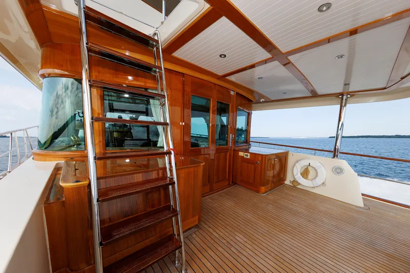 Slide: The Image of Luxurious 2016 Hunt Yachts 72 FB deck with wooden finishes and ocean view. - 7