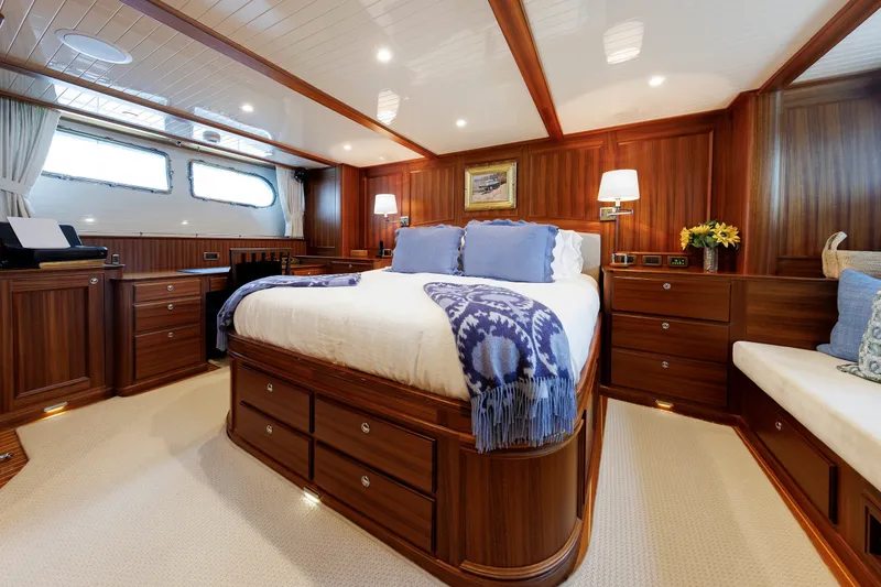 Slide: The Image of Luxurious 2016 Hunt Yachts 72 FB cabin with elegant wood finish and cozy bedding. - 3