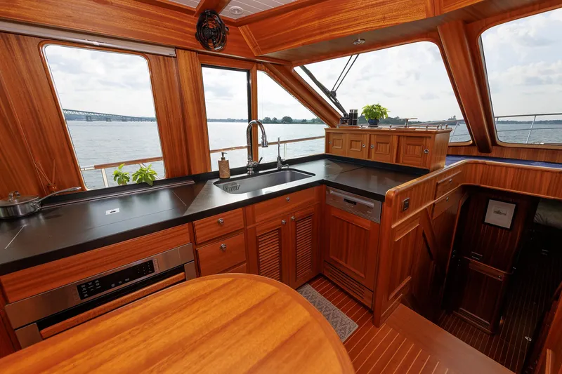 Slide: The Image of Luxurious 2016 Hunt Yachts 72 FB interior kitchen with wood finish and ocean view. - 2