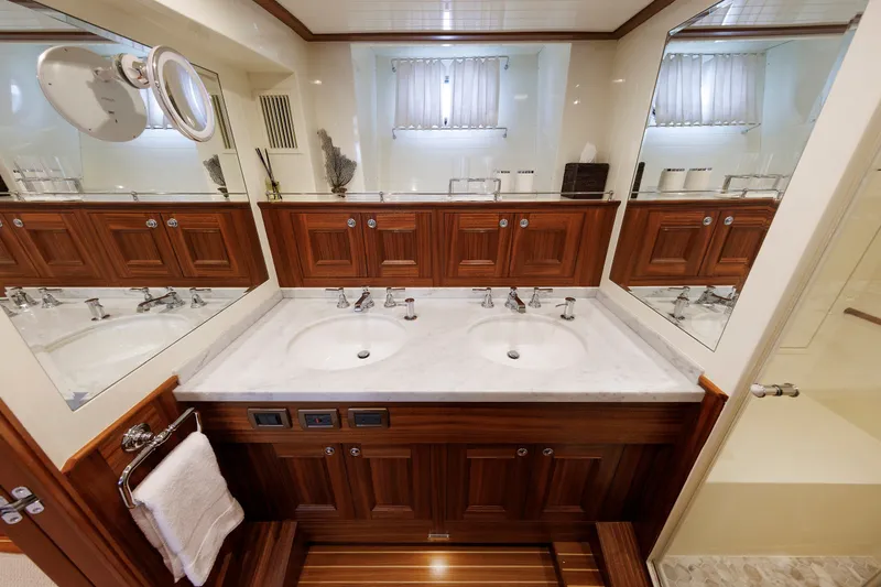 Slide: The Image of Luxurious bathroom in 2016 Hunt Yachts 72 FB, featuring dual sinks and elegant wood cabinetry. - 34