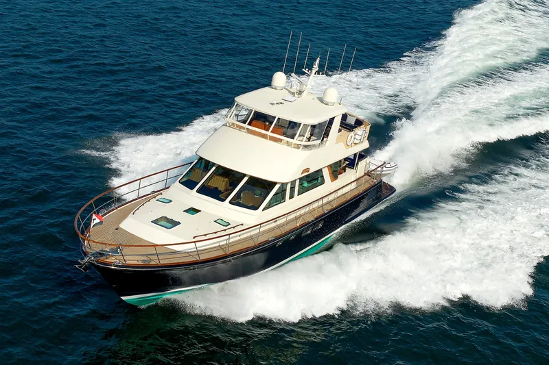 Slide: The Image of Luxurious 2016 Hunt Yachts 72 FB cruising swiftly on open water. - 84