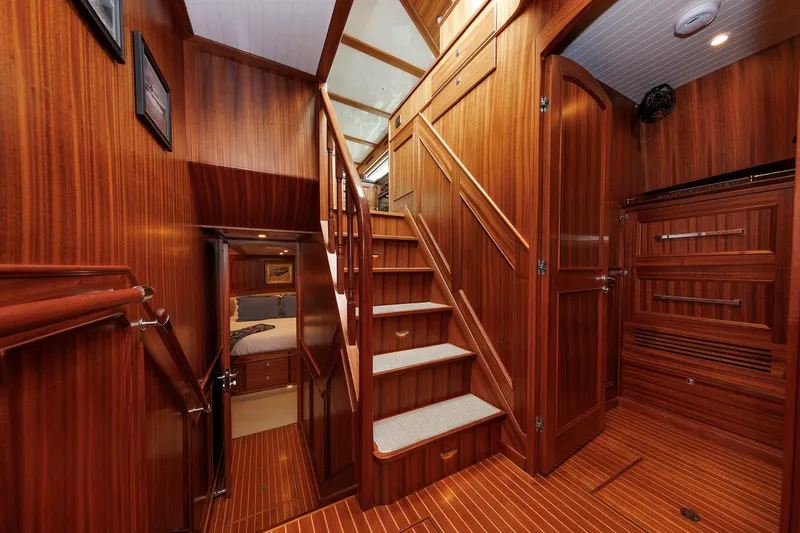 Slide: The Image of Luxurious wooden interior of 2016 Hunt Yachts 72 FB, featuring elegant stairs and cabin access. - 24