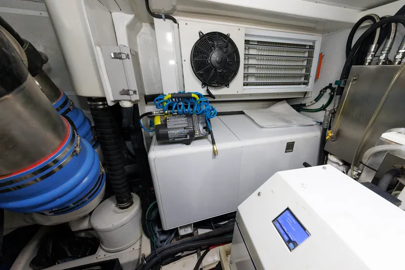 Slide: The Image of Engine room of 2016 Hunt Yachts 72 FB, featuring machinery and ventilation system. - 72
